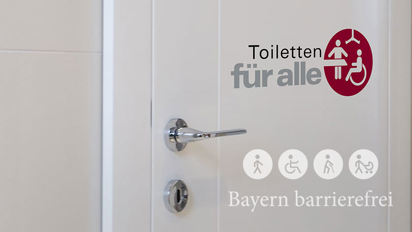 Tür mit Signet „Toiletten für alle“.